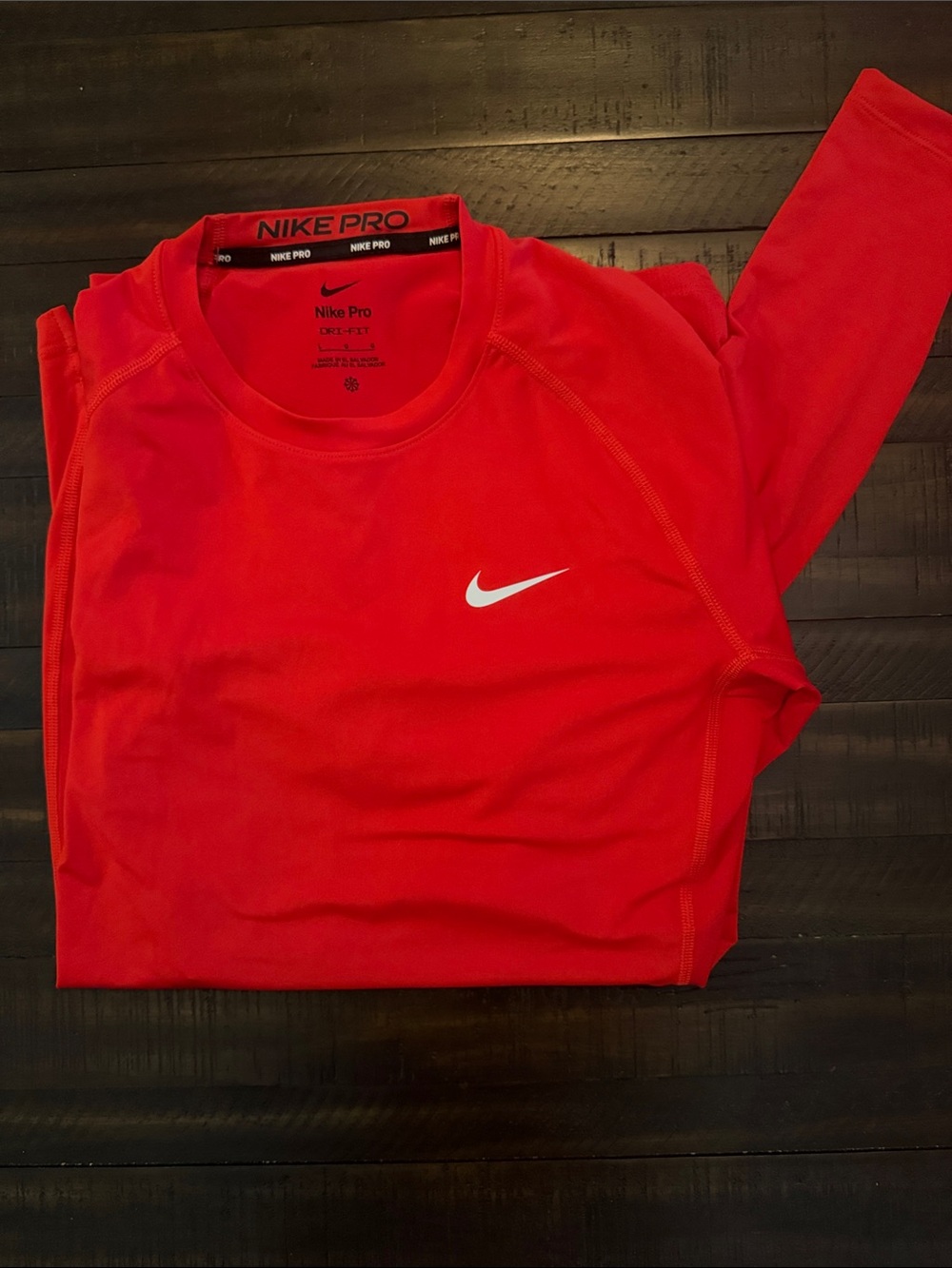 Nike Red Long Sleeve Performance Top with White Swoosh